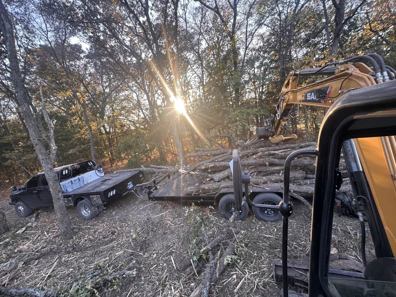 Rezz Built excavator loaded for a job at sunset in Oklahoma