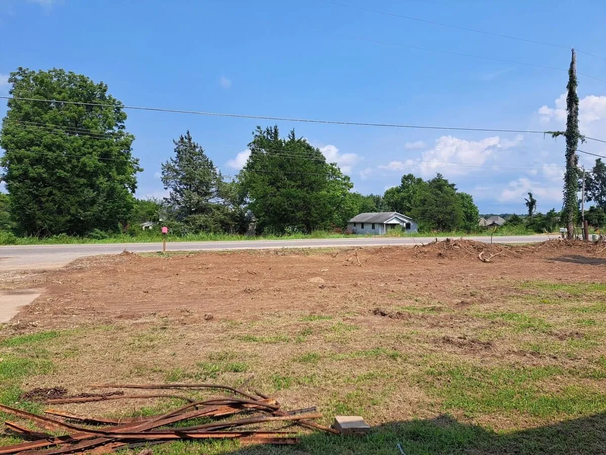 Lot stripped and rough graded for site prep beside an Oklahoma road